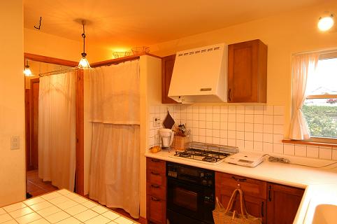 The back side of kitchen looks neat and tidy, too.