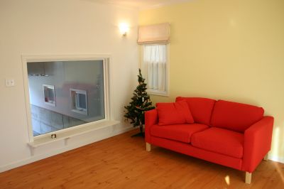 Big window at living room overlooks the garage