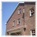 Brick cladding houses stand side by side